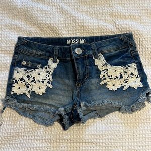 Distressed jean shorts with lace